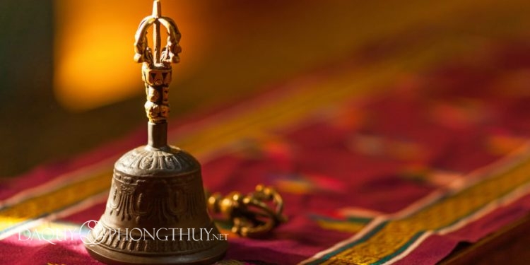 Ritual hand bell in the Buddhist temple as the enlightenment symbol, has got to a light beam.